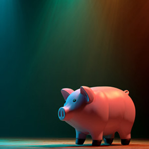 A charming piggy bank under a spotlight.