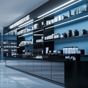 A rather sleek and dramatic shop counter and shelves to represent the retail industry.